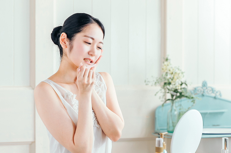 虫歯・知覚過敏・歯周病の女性